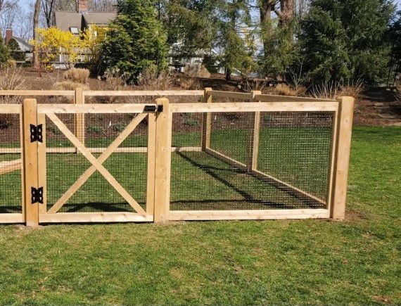 A wooden and wire fence