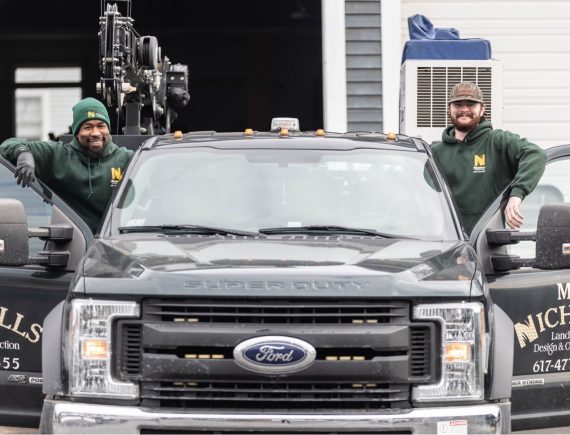 Two Nicholls employees getting into a Nicholls truck