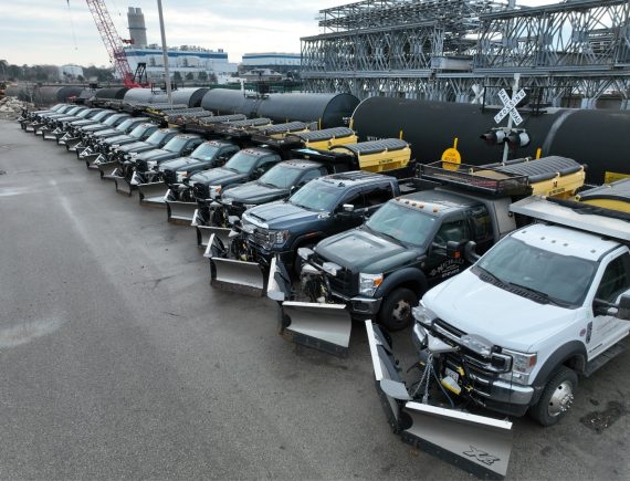 A line of Nicholls snow plows